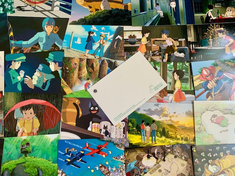 May include: A collection of postcards featuring scenes from Studio Ghibli animated films. The postcards are arranged in a collage, with some overlapping. The images include characters from the films, such as Totoro, Kiki's Delivery Service, and Spirited Away. The postcards are printed on high-quality cardstock and are perfect for framing or sending to friends and family.
