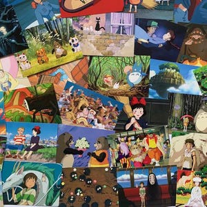 May include: A collection of colorful postcards featuring characters and scenes from popular animated films. The postcards are arranged in a random pattern and include images of a black cat, a flying house, a white fluffy creature, and a girl with a red bow.