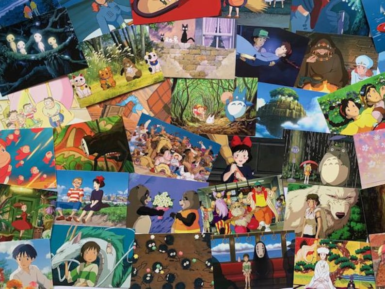May include: A collection of colorful postcards featuring characters and scenes from popular animated films. The postcards are arranged in a random pattern and include images of a black cat, a flying house, a white fluffy creature, and a girl with a red bow.