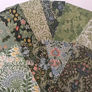 May include: A collection of eight patterned paper sheets featuring floral and botanical designs in shades of green, blue, and white. The patterns are reminiscent of vintage wallpaper or fabric.