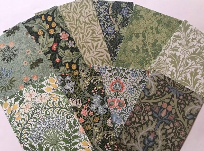 May include: A collection of eight patterned paper sheets featuring floral and botanical designs in shades of green, blue, and white. The patterns are reminiscent of vintage wallpaper or fabric.