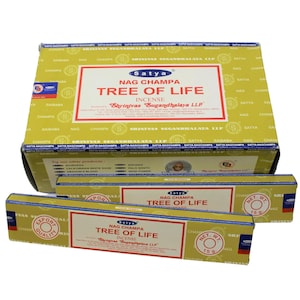 May include: A box of Satya Nag Champa Tree of Life incense sticks. The box is yellow with blue and red text. The incense sticks are packaged in a yellow and blue wrapper with the same text as the box.