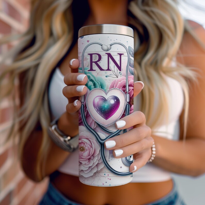 May include: A white stainless steel tumbler with a floral design and a stethoscope with a heart and the letters "RN" in purple.