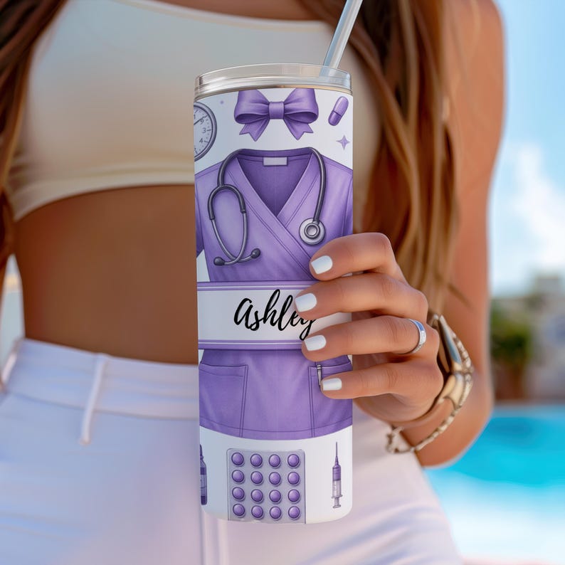 May include: A purple and white stainless steel tumbler with a personalised name "Ashley" and a design of a nurse's uniform, stethoscope, pills, and a syringe.