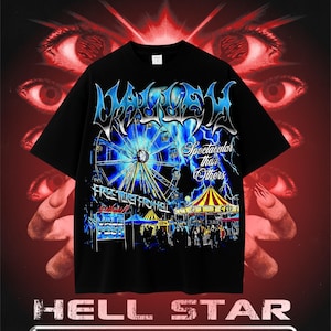 May include: Black t-shirt with a graphic design featuring a Ferris wheel, carnival, and text that reads "WASTED" and "Spectacular than Others". The shirt also has the text "FREE TICKET FROM HELL" and "VALE FEST".