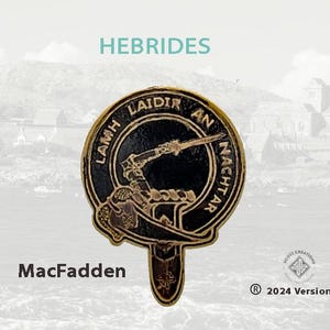 May include: A gold-colored metal pin with a black and gold design. The pin features a crest with the text "Lamh Laidir An Nacht Air" and the word "HEBRIDES" above the crest. The text "MacFadden" is below the crest. The pin is a clan crest.