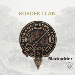 May include: A bronze-colored clan crest with the words "Courage Helps Fortune" around the edge. The crest features a sword and a knot design. The words "Blackadder" are printed below the crest.