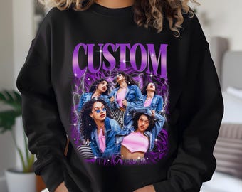 May include: Black sweatshirt with a purple and white graphic print of the word "CUSTOM" and five women wearing sunglasses and denim jackets.