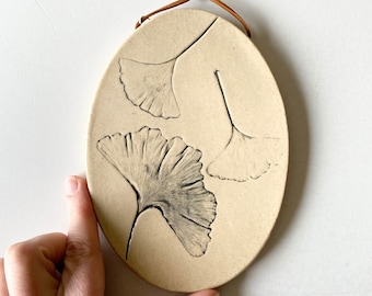 Botanical ceramic wall hanging with ginkgo leaf imprint, a rustic pottery wall hanging for farmhouse decor