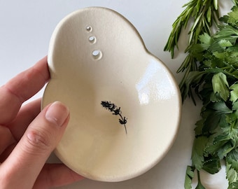 Stoneware ceramic herb stripper bowl with lavender imprint, a small country kitchen gadget