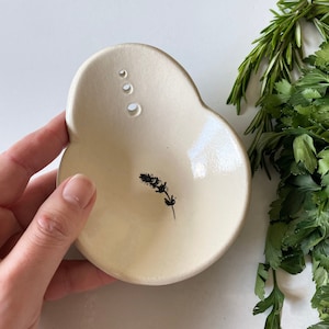 Stoneware ceramic herb stripper bowl with lavender imprint, a small country kitchen gadget