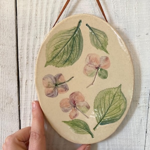 Botanical ceramic wall hanging with hand painted hydrangea imprint, a rustic pottery wall hanging for farmhouse decor