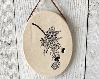 Botanical ceramic wall hanging with cedar imprint, a rustic pottery wall hanging for farmhouse decor