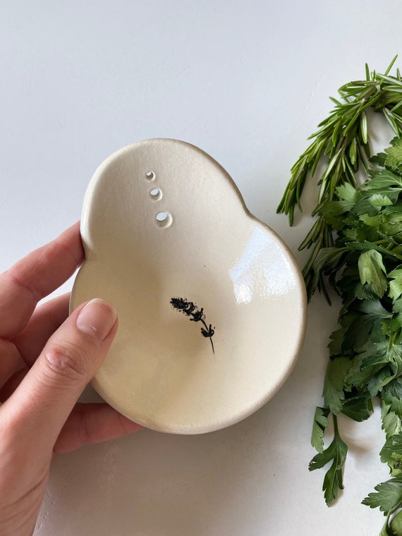 Stoneware ceramic herb stripper bowl with lavender imprint, a small country kitchen gadget