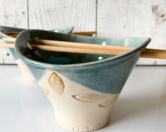 Ceramic noodle bowl with chopsticks, handmade ramen or rice bowl in teal green