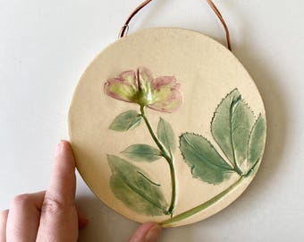 Botanical ceramic wall hanging with hand painted hellebore imprint, a rustic pottery wall hanging for farmhouse decor