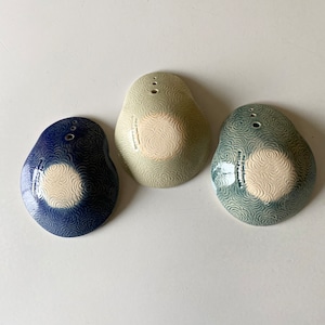 May include: Three ceramic bowls with a swirl pattern. The bowls are in shades of blue, green, and white.