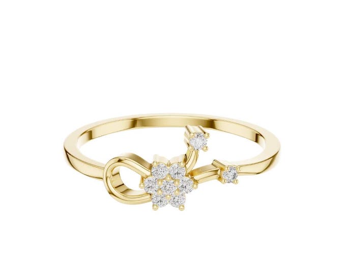 Delicate gold ring featuring a sparkling star-shaped diamond design with small accent diamonds perfect for elegant and stylish everyday wear