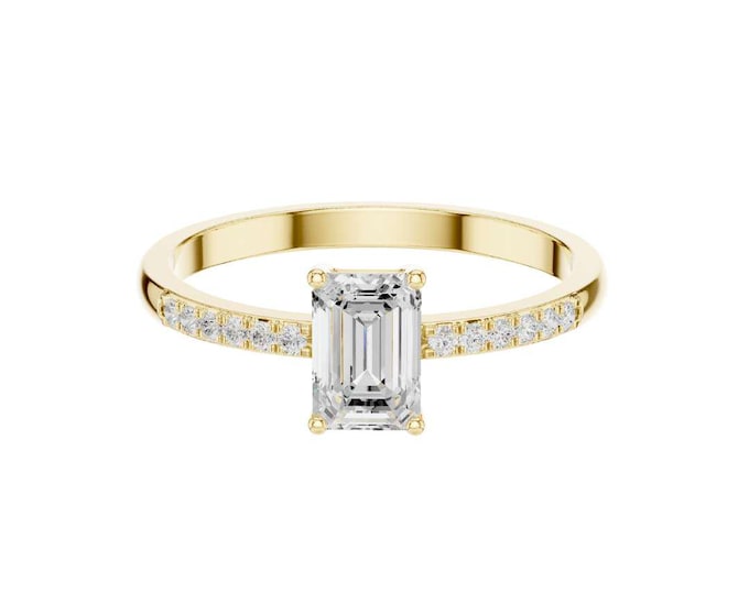 Elegant Yellow Gold Ring Featuring an Emerald-Cut Center Diamond with Sparkling Cluster Side Accents and a Pave Diamond Studded Band