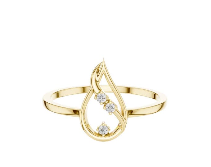 Elegant gold ring with teardrop design and sparkling diamond accents perfect for special occasions and everyday wear