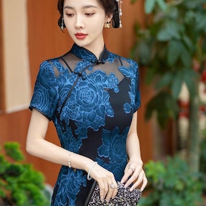 duck egg blue asian dress A cheongsam that's perfect in its simplicity. Beautiful duck egg blue Thai silk, cut in a sculpted silhouette and finished with delicate pearl buttons