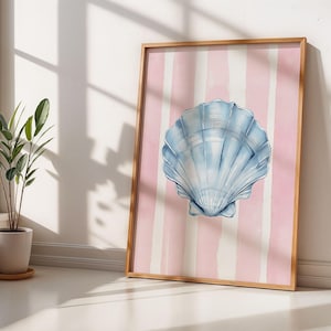 May include: A framed watercolour painting of a blue seashell on a pink and white striped background.