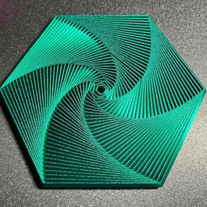 May include: A teal-colored, hexagonal coaster with a spiral design. The coaster's surface features a series of parallel lines that converge towards the center, creating a mesmerizing optical illusion. The edges are clean and defined, giving it a modern aesthetic.
