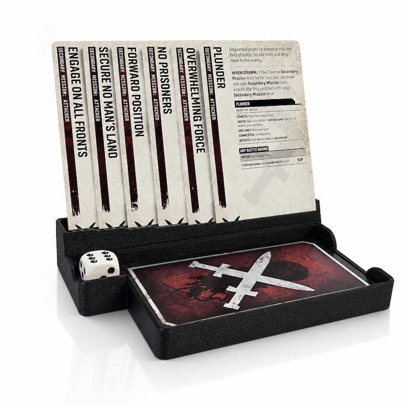 May include: A black card organizer holding six game cards with titles including Plunder, Overwhelming Force, No Prisoners, Forward Position, Secure No Man's Land, and Engage on All Fronts, alongside a white six-sided die and a deck of cards.