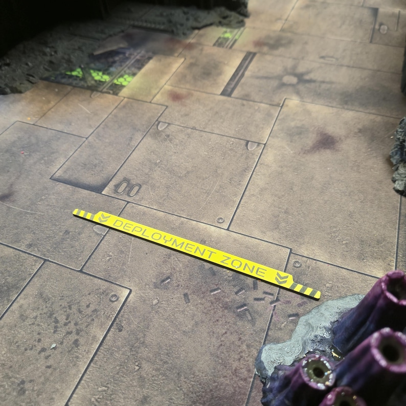 Warhammer 40k Deployment zone Guide in yellow with hazard markings, laid on a table ready to play