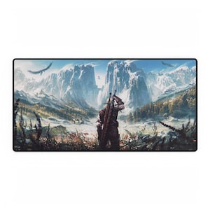 May include: A rectangular mousepad featuring a fantasy landscape with a figure carrying a sword, set against a backdrop of snow-capped mountains and flying birds. The color palette includes blues, greens, and browns.