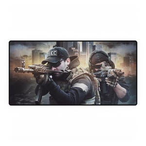 May include: A rectangular mousepad featuring two figures in tactical gear aiming firearms. The background depicts a cityscape with a sunset. One figure wears a black cap with "SEC" on it. The mousepad is designed for gaming or computer use.