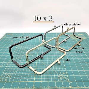 May include: A handmade wooden sign with the text "Welcome" in a playful font. The sign is painted white with a distressed finish, and features a small, decorative heart. Dimensions are approximately 12 inches wide and 6 inches tall.