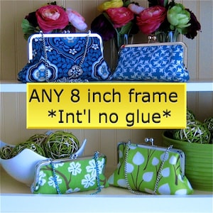 May include: Three fabric-covered clutch purses with silver frames and chains. The purses are displayed on a white shelf with a yellow sign that reads "ANY 8 inch frame *Int'l no glue*"