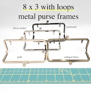May include: Metal purse frames in gold, silver nickel, gunmetal, and antique brass. The frames are rectangular with loops and a ball clasp. Text on the image reads "8 x 3 with loops metal purse frames."