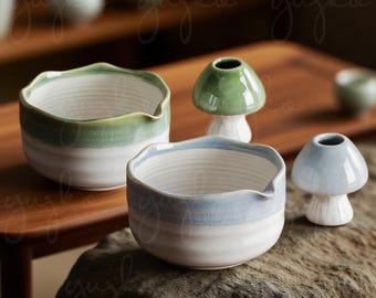 May include: Ceramic bowls and mushroom-shaped vases in shades of green and blue. The bowls have a white base with a colored rim and a wavy edge. The mushroom vases have a white stem and a colored cap.