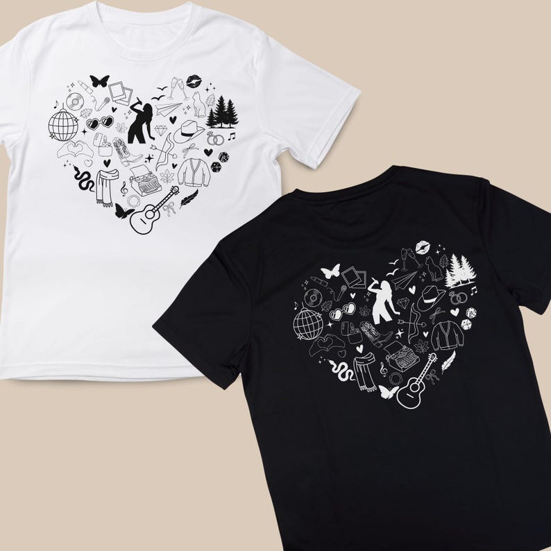 May include: Two t-shirts with a heart-shaped design featuring a variety of black and white illustrations. The design includes a guitar, a typewriter, a snake, a pair of sunglasses, a hat, and a pair of trees.