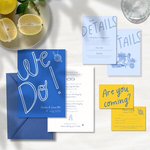 May include: Wedding invitation suite featuring a blue "We Do!" card with the names Sacha & Camille and the date July 18, 2026. Includes details and RSVP cards in blue and yellow, with a disco ball graphic.
