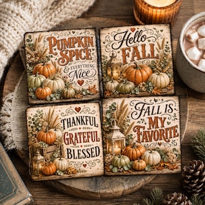 May include: Four square coasters featuring autumn-themed illustrations of pumpkins, lanterns, and wheat. The text reads: Pumpkin Spice & Everything Nice, Hello Fall, Thankful Grateful Blessed, and Fall Is My Favorite, all in decorative script and block fonts.