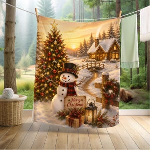May include: A Christmas-themed tapestry featuring a snowman with a top hat and scarf, a decorated Christmas tree, and a snow-covered cabin. The tapestry includes a sign that reads "Merry Christmas" and a lit lantern. The background shows a sunset over a snowy landscape.