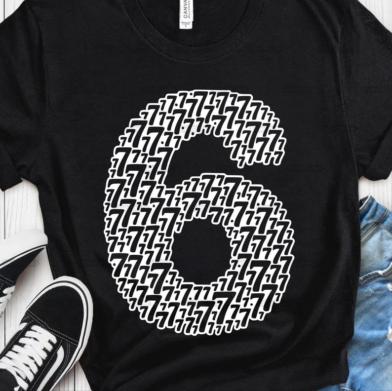 May include: Black t-shirt with a large white number six graphic. The number is composed of a pattern of smaller sevens. A pair of black and white sneakers is visible in the lower left corner.