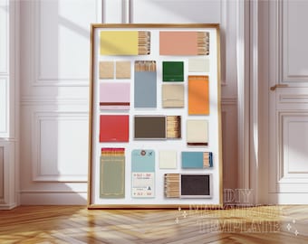 May include: A framed collage of matchboxes in various colors and patterns, including red, blue, green, yellow, and orange. The matchboxes are arranged in a grid pattern on a white background. The text "DIY MATCHBOX TEMPLATE" is printed below the collage.