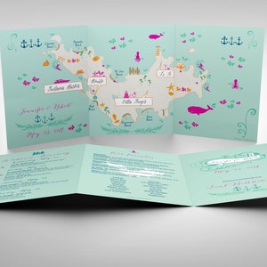 May include: A folded wedding invitation with a map of an island on the front. The map is illustrated with various landmarks and features, including a lighthouse, a whale, and a boat. The invitation is decorated with a nautical theme, including anchors and seashells. The text on the invitation reads "Jennifer & Robert, May 23, 2017".