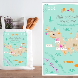 May include: A white tote bag with a map of St. Barths printed on it. The map is in a light blue color with orange, pink, and yellow accents. The text on the bag reads "Sala & Brandon May 13, 2017".