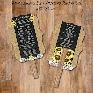 May include: Two burlap wedding program fans with a chalkboard background and sunflower accents. The fans are decorated with white lace and have wooden handles. The text on the fans includes the names "Jay & Melissa" and the wedding date. The fans are designed for a rustic wedding theme.