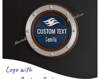 May include: A circular wooden plaque with a silver rim and a dark blue centre. It features a white logo and the words "CUSTOM TEXT" above "Family" in white. The plaque is mounted on a dark surface.