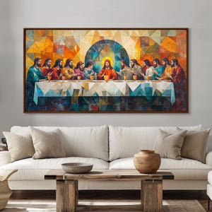 May include: A framed artwork depicting the Last Supper. The painting features Jesus and his disciples seated at a table, with a geometric background in shades of orange, yellow, and blue. The artwork is displayed above a white sofa.