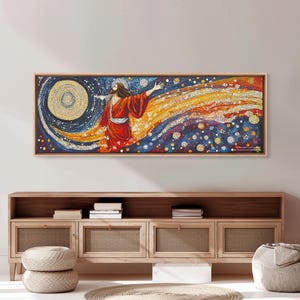May include: A framed artwork depicting a figure in a red robe with outstretched arms, set against a backdrop of a swirling galaxy. The artwork features a large, circular element and a vibrant color palette of blues, oranges, and yellows.