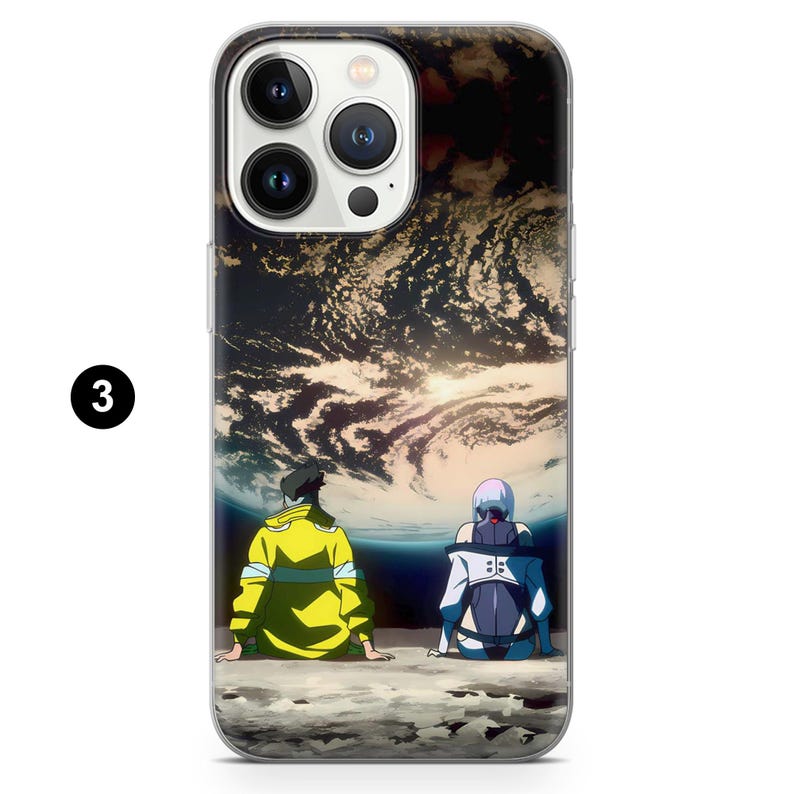 May include: Clear phone case featuring a colorful anime-style illustration. The design shows two figures seated, gazing at a planet with a dramatic sky. The case has a glossy finish and a number 3 in a black circle.