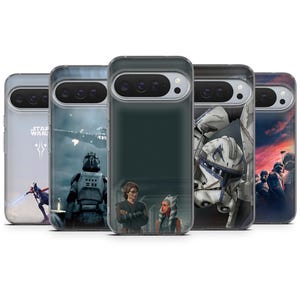 May include: A collection of phone cases featuring Star Wars characters and scenes. The cases display images of characters like Darth Vader, Ahsoka Tano, and Clone Troopers. The cases are clear with a dark border and are designed to fit a specific phone model.