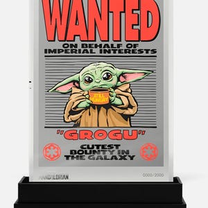 May include: A silver-framed poster featuring Grogu from The Mandalorian, holding a mug that says "Still Hungry." The poster reads "WANTED" in red, with text below. The bottom reads "Grogu, Cutest Bounty in the Galaxy."